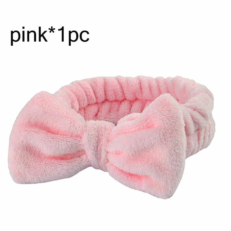 Soft pink hair towel with a bow design made of quick dry microfiber hair towels for efficient drying