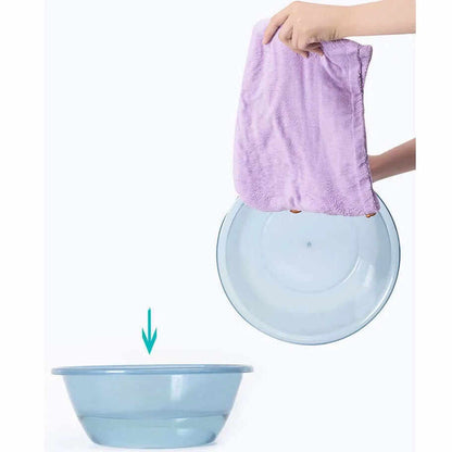Purple quick dry microfiber hair towels being used to absorb moisture after washing